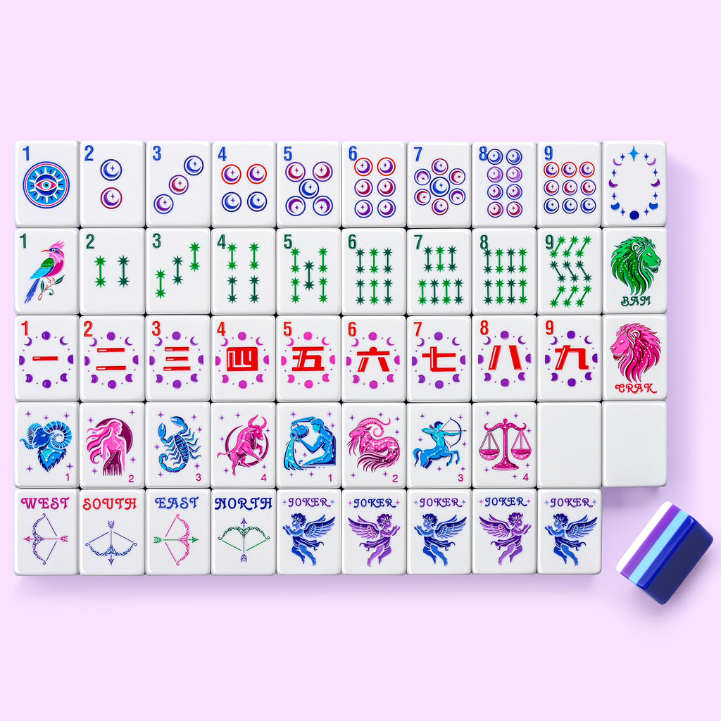 Lunara Celestial mahjong tiles laid out on a soft pink background